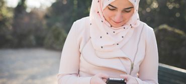 A Lady looking at her smart phone